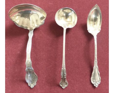 An American sterling silver gravy ladle dated 1911 together with two American sterling silver serving spoons, 3 and 1/2oz