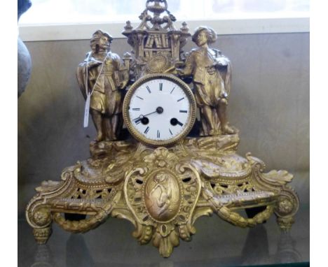 A gilt figural mantel clock