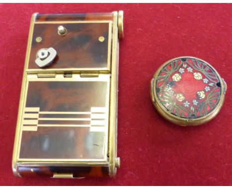 A lady's enamel powder compact together with a combination cigarette case and a musical compact in the form of a camera (2)