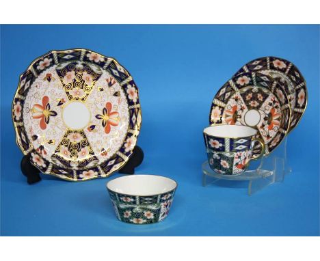 A Royal Crown Derby Imari tea service comprising; two cake plates, six side plates, six cups and saucers and a sugar bowl, re