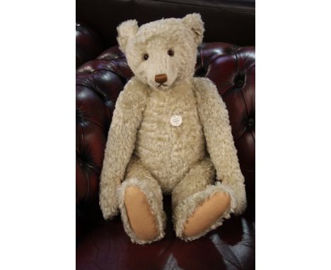 A modern Steiff teddy bear.