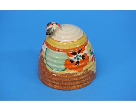 A Clarice Cliff Bizarre 'Nasturtium' pattern beehive shape honey pot and cover, black printed mark.  10 cm high