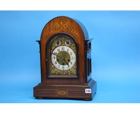 An Edwardian mahogany and inlaid bracket clock with 8 day movement, chiming action, silvered chapter ring, brass spandrels, i