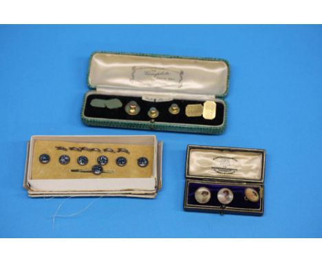 A set of gold plated cuff links and studs, three portrait studs and a decorative set of studs.