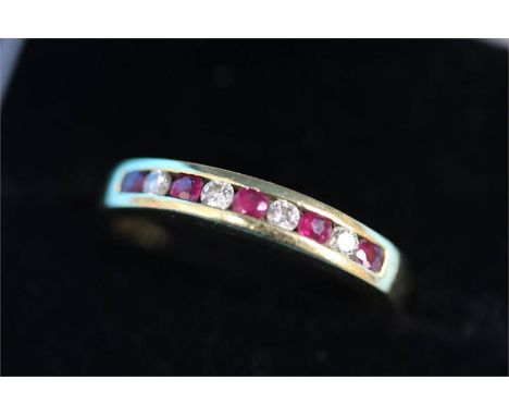 A 9ct gold diamond and ruby ring.