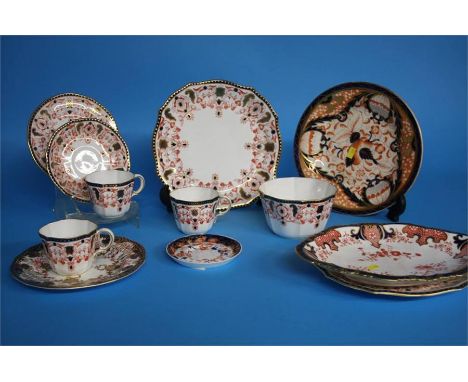 A part Royal Crown Derby tea set comprising; two cake plates, three side plates, three cups and saucers, printed marks, numbe