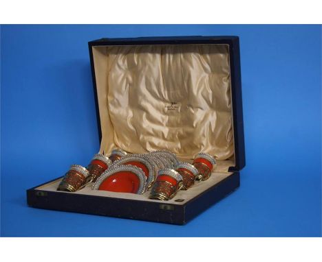 A cased set of six Aynsley coffee cans and saucers with silver mounted cup holders, Sheffield 1935, makers mark Walker and Ha
