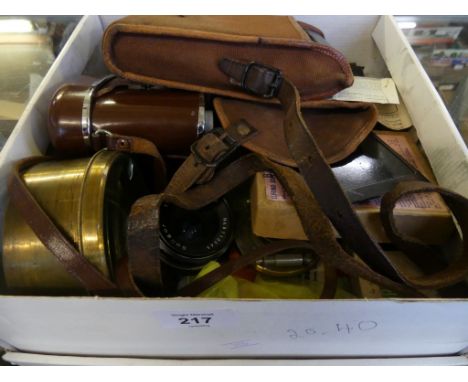 A box of vintage Kodak cameras, assorted lenses, and other items. 