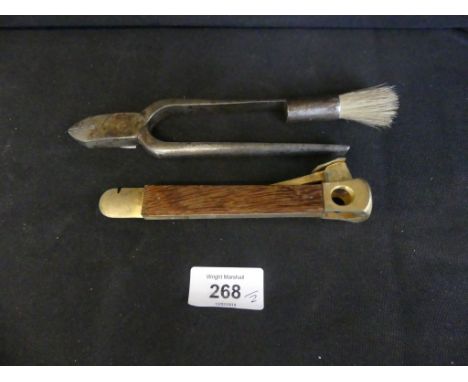 A mixed lot comprising vintage champagne bottle pliers, with integral brush, together with a cigar cutter (2) 