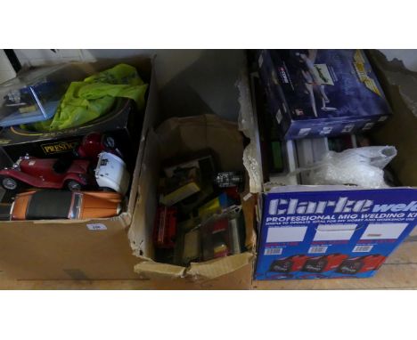 Three boxes of various mixed toys cars and model trains to include Solido, Burago and many others 
