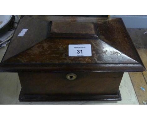 A 19th Century mahogany sarcophagus formed tea caddy with two section interior. 