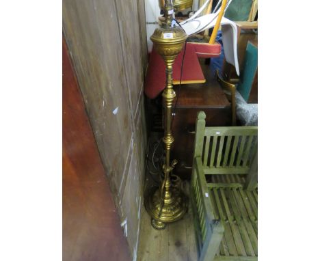 An early 20th Century brass lamp standard, later converted. 