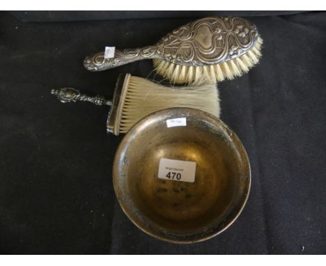 A sterling silver circular sugar basin together with two silver backed brushes. 