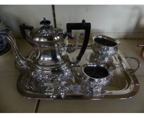 A silver-plated four piece tea and coffee service, with accompanying tea strainer and double handled tray. 