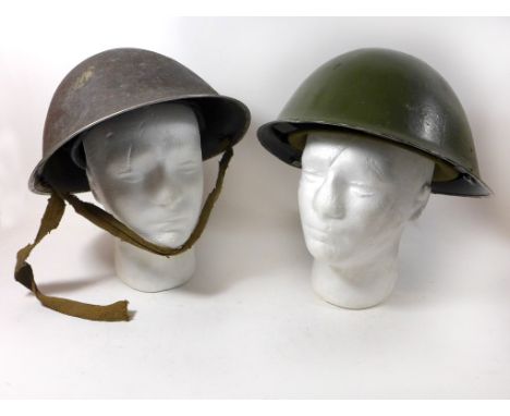 Two British painted steel Army helmets, late 20th CenturyThe first with green painted shell, inner lining with label for R.M.