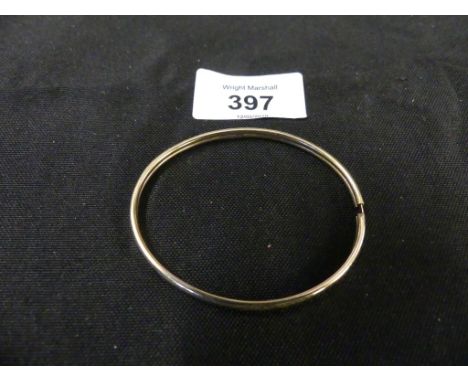 A 9ct gold bangleThe polished bangle with grooved sides, weight approx. 5.2g. 