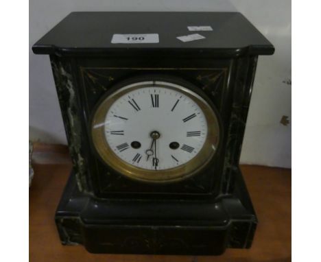 A black slate and marble mounted mantel clock 