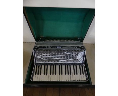 A vintage cased piano accordion marked Settimio Soprani 