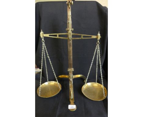Vintage brass beam scales raised on three footed  base marked W&T Avery Birmingham 