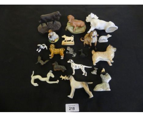 A mixed lot of various miniature ceramic, glass and wood model dogs 