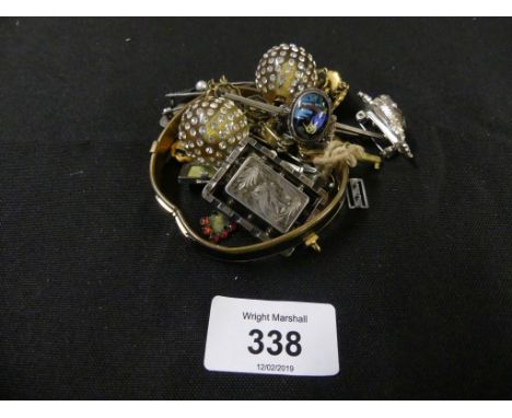 A selection of costume jewelleryTo include a shakudo bracelet, silver brooches, a hinged bangle, etc. 