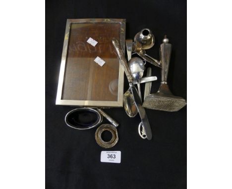 A selection of silver items to include a frame, candlestick etc 