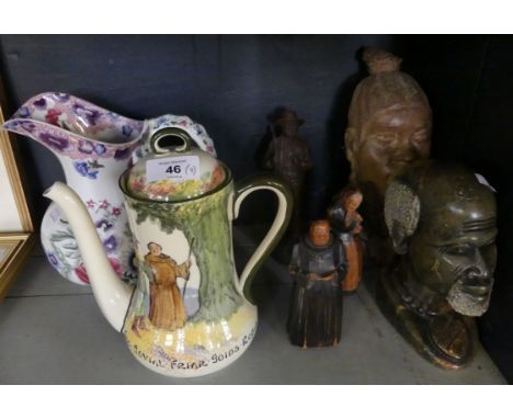 A mixed lot comprising a pair of wooden figures modelled as a monk and an elderly lady, together with an African hardstone fi
