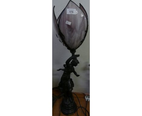 A modern table lamp with figural stem and plinth base 