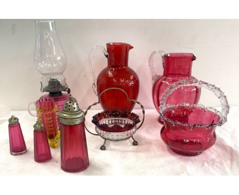 Selection of antique and later Cranberry glass to include an oil lamp, jugs etc 