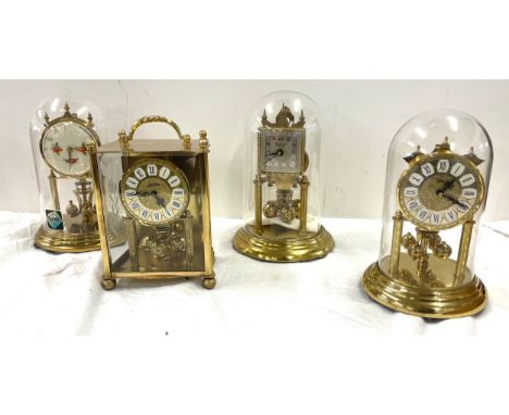 3 Vintage dome clocks with glass domes and 1 other carriage clock 