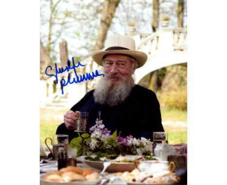 PLUMMER CHRISTOPHER: (1929-2021) Canadian actor, Academy Award winner. Signed colour 8 x 10 photograph of Plummer seated outd