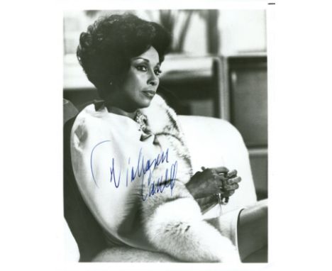 CARROLL DIAHANN: (1935-2019) American actress and singer. Signed 8 x 10 photograph of Carroll seated in a three-quarter lengt