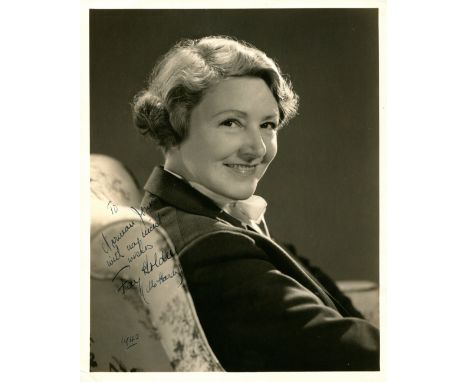 HOLDEN FAY: (1893-1973) British-born American actress. Vintage signed and inscribed 8 x 10 photograph of Holden seated in a h