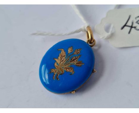 A Victorian blue enamel locket with flower decoration 