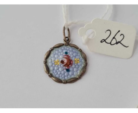 A small silver and enamel flower pendant