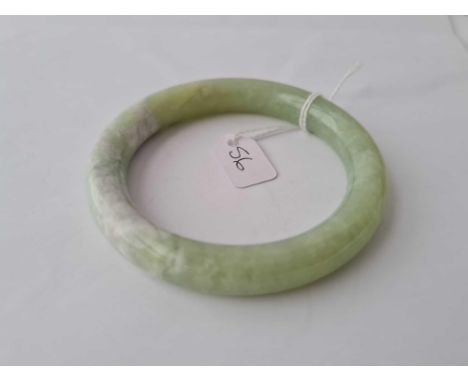 A green hard stone bangle 