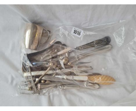 A bag of cutlery including cheese scoop, bread fork etc.