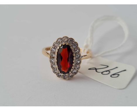 A white sapphire &amp; garnet set 9ct dress ring bearing Chester marks 1957 size M