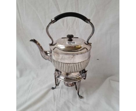 A half fluted kettle on stand with lamp.