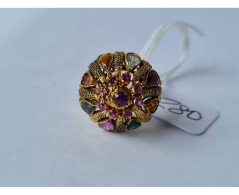 A yellow metal dome ring set with citrIns pink and green tourmalines garnet amethyst and emerald size O