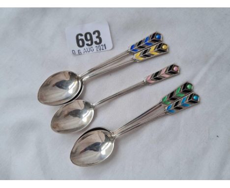 Five art deco style enamel decorated coffee spoons, B;ham 1935 with silver jubilee mark, 