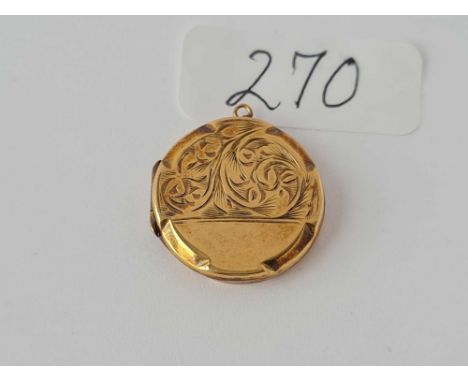 A circular vintage scroll engraved 9ct back &amp; front locket