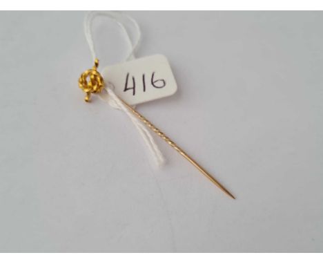 A sailors knot gold terminal stick pin in high carat