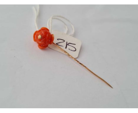 A coral rose head topped gold stick pin 