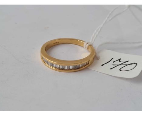 An 18ct gold mounted half eternity ring set with baguette diamonds approx size L