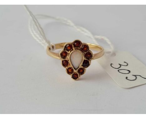 A pear shaped opal ring with amber border in 9ct gold size O 2.6g inc