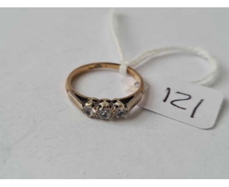 A three stone dress ring set in gold size K1/2 