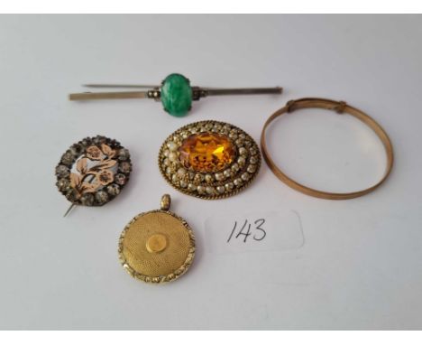 Three antique brooches a RG bangle and a circular glass sided locket