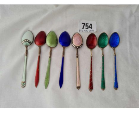 Eight various enamel decorated coffee spoons.