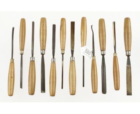 A probably unused set of 12 carving tools by MARPLES with beech handles in orig poor box F